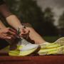 Athlete tying their shoelaces