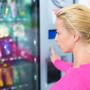 A woman looking at a vending machine