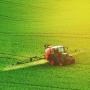 A tractor spraying chemicals