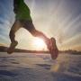 Person running in winter during sunset