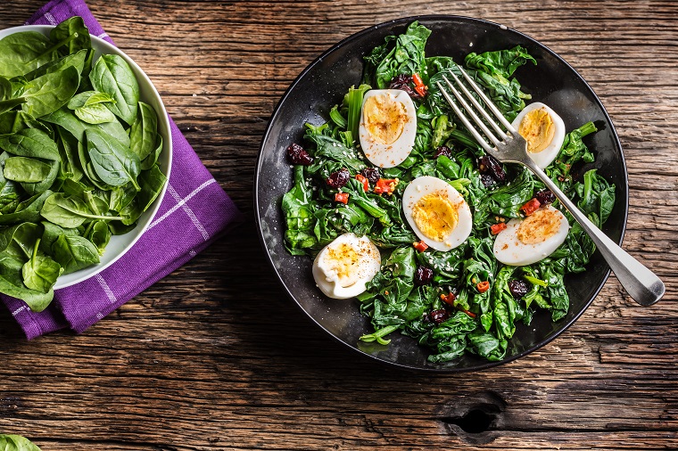 Spinach and egg salad in a bowl
