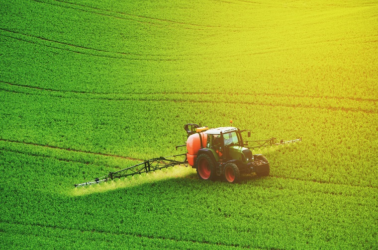 A tractor spraying chemicals
